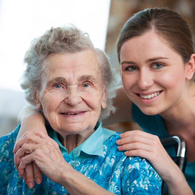 Senior woman with her caregiver at home